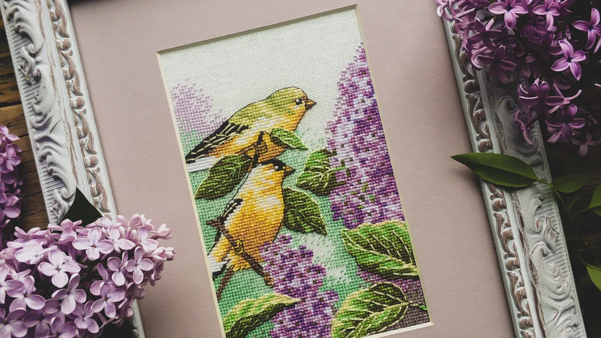 Framed embroidered birds and flowers